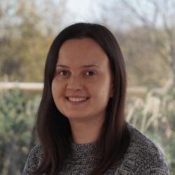 A portrait of a woman looking at the camera
