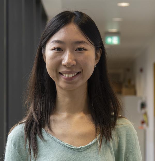 Portrait of a woman in a laboratory corridor