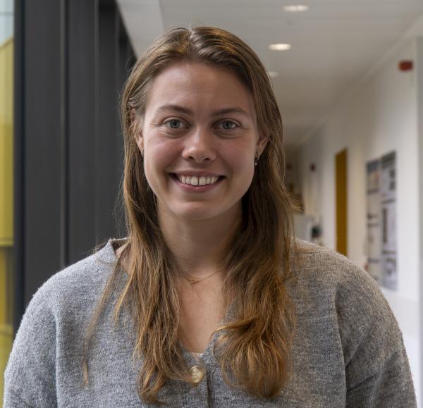 Portrait of a woman in a laboratory corridor