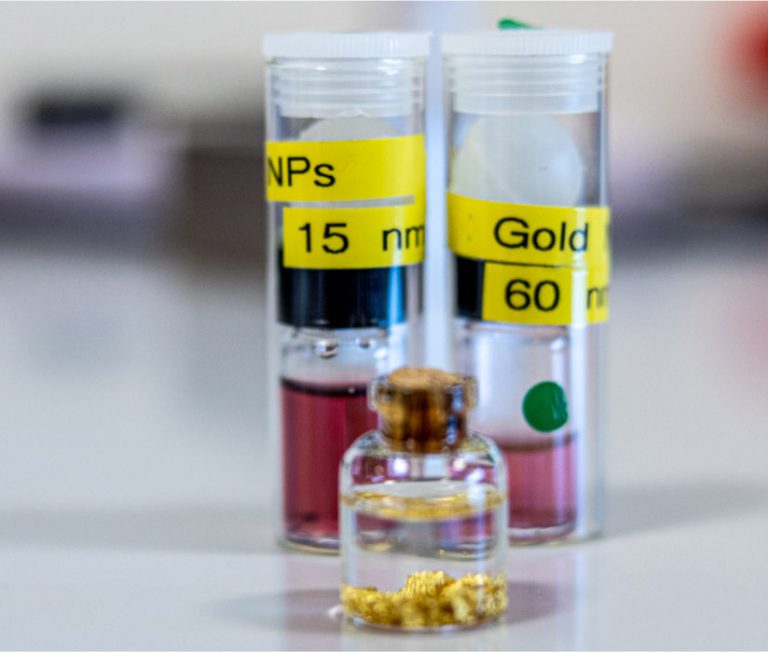 Three vials on a laboratory workbench